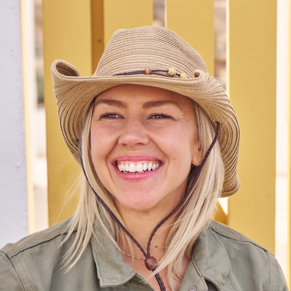 Woman wearing a Sunday Afternoons Sunset Hat.