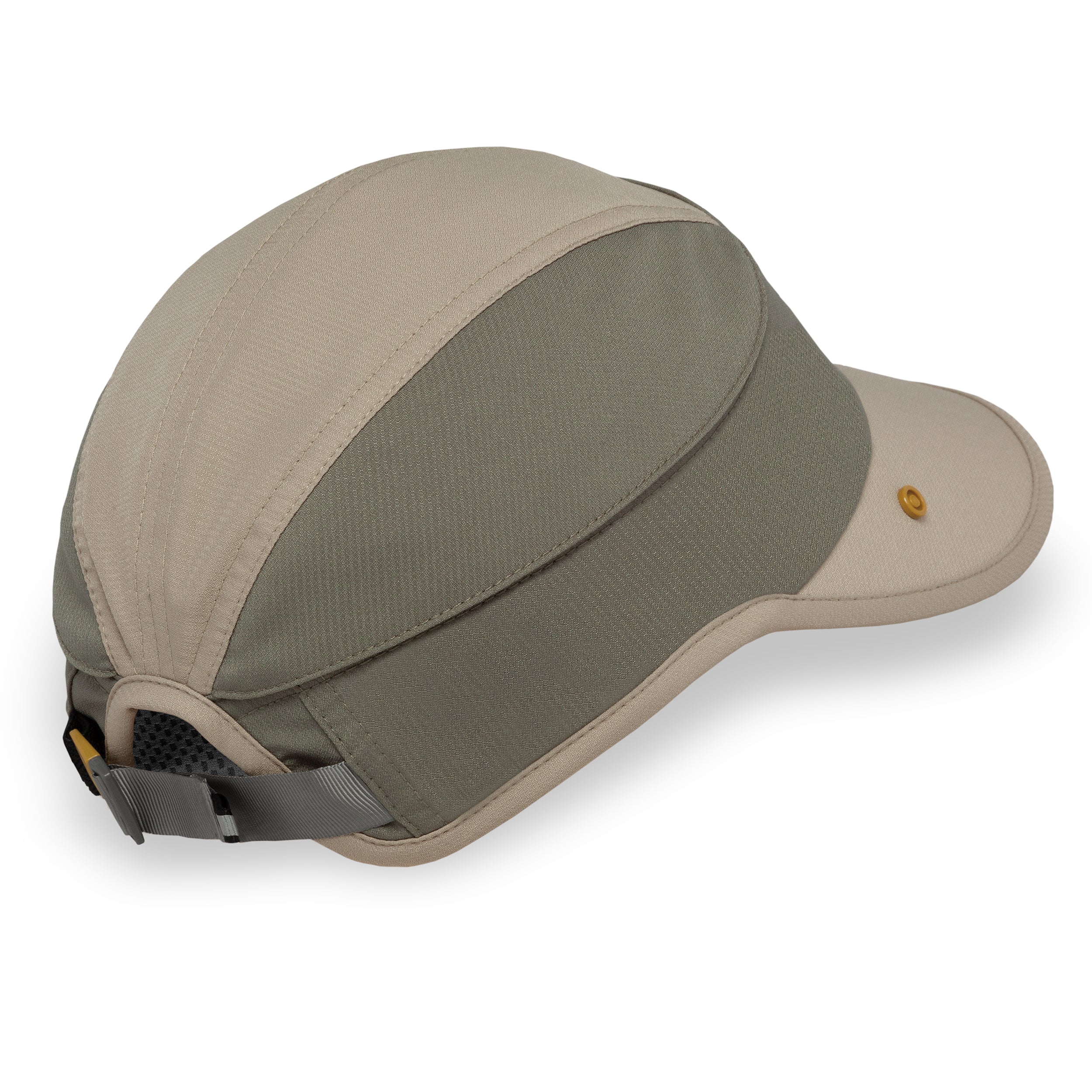 A multi-panel outdoor cap in beige and gray-green, featuring a curved brim, a small gold button on the side, and an adjustable mesh back strap.